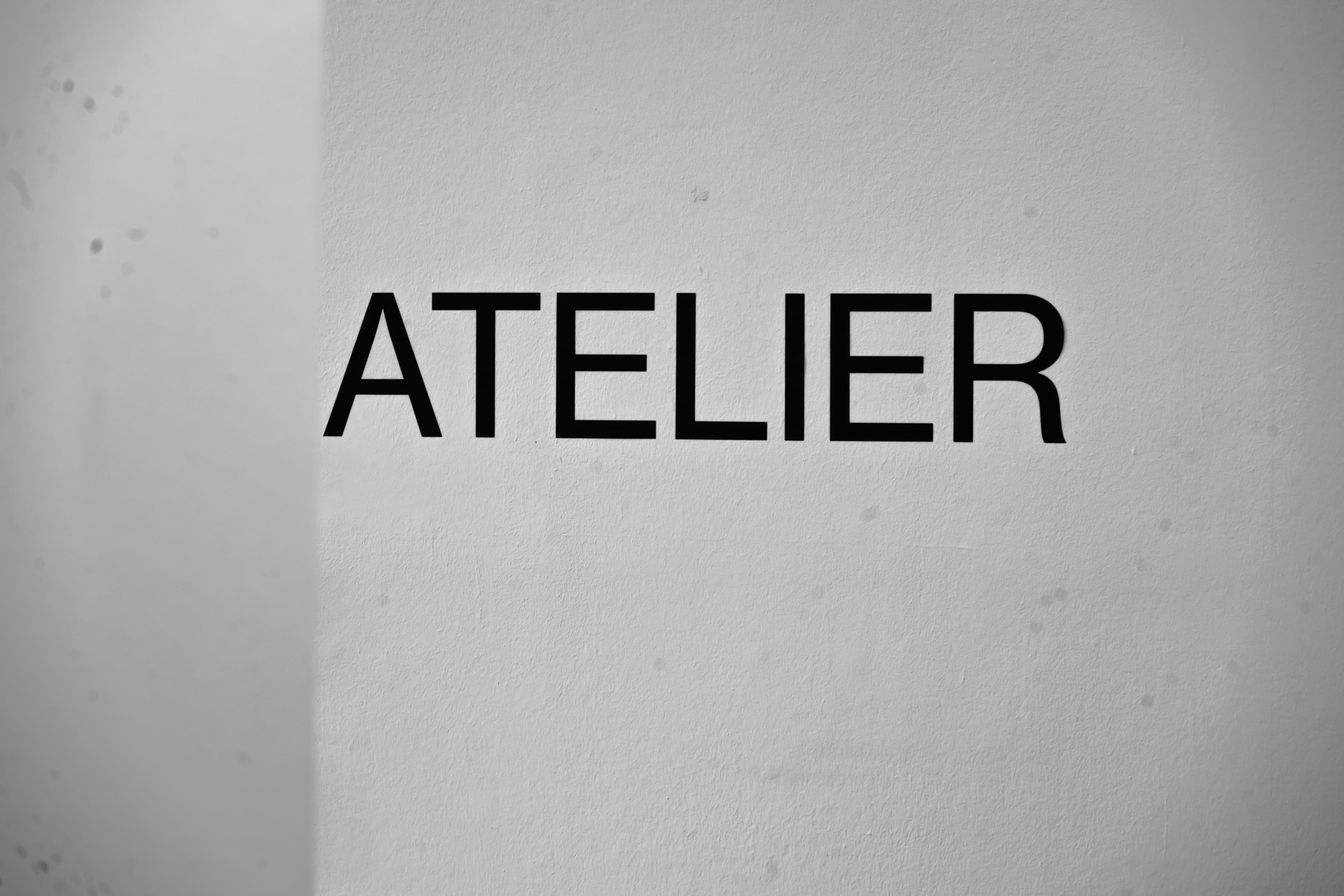 Modern atelier wordmark inside the LEDE workspace