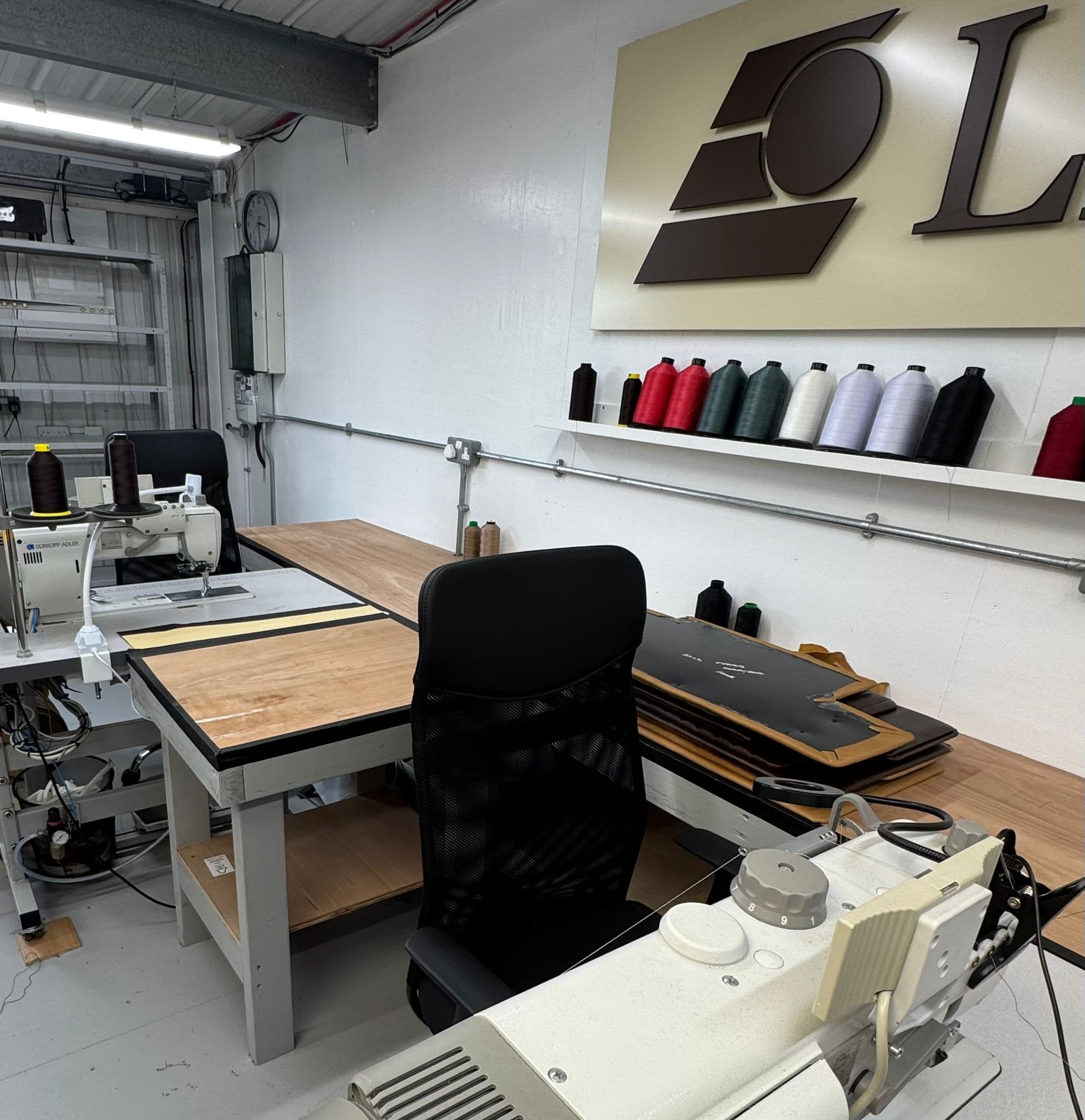 LEDE atelier workspace with sewing machines, thread and cutting tables